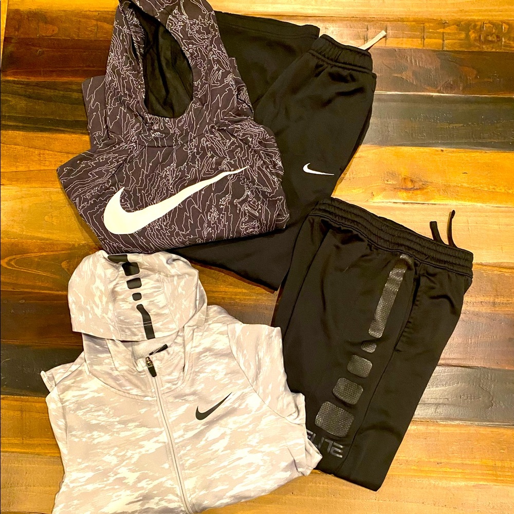 2 sets of boys Nike outfits.